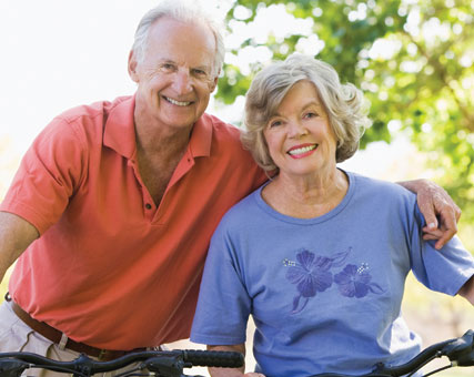 Photo of a man and woman on bicycles. Link to Life Stage Gift Planner Ages 60-70 Situations.